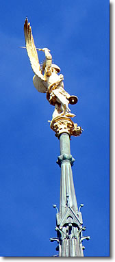 Golden statue of Saint Michael atop the abbey church spire, Mont St-Michel, France