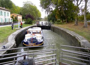 Boat in a lock on the Canal du Midi, France